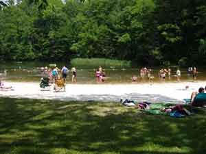 Swimmers at Cave Mountain Lake at the campground