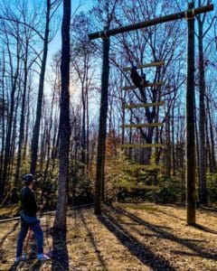 User on the Goliath Ladder at Wilderness Presidential Resort Adventure Park