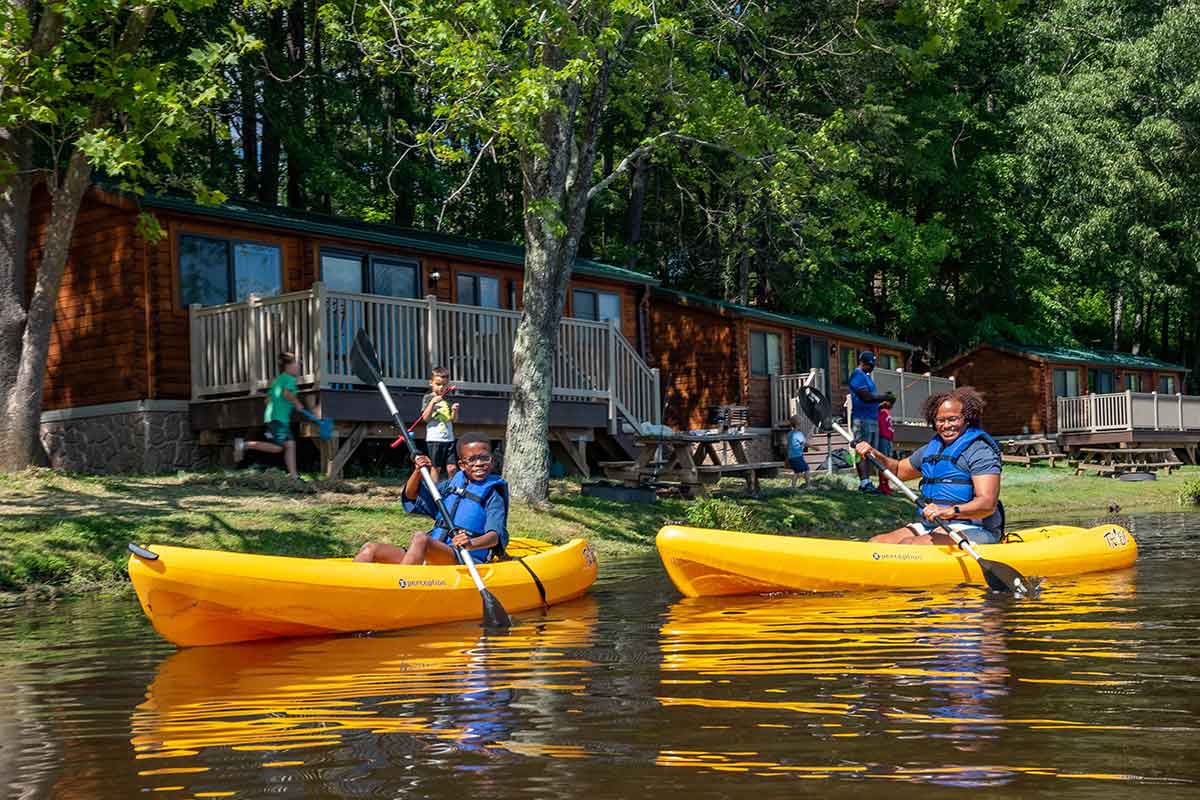 cabin and kayaks