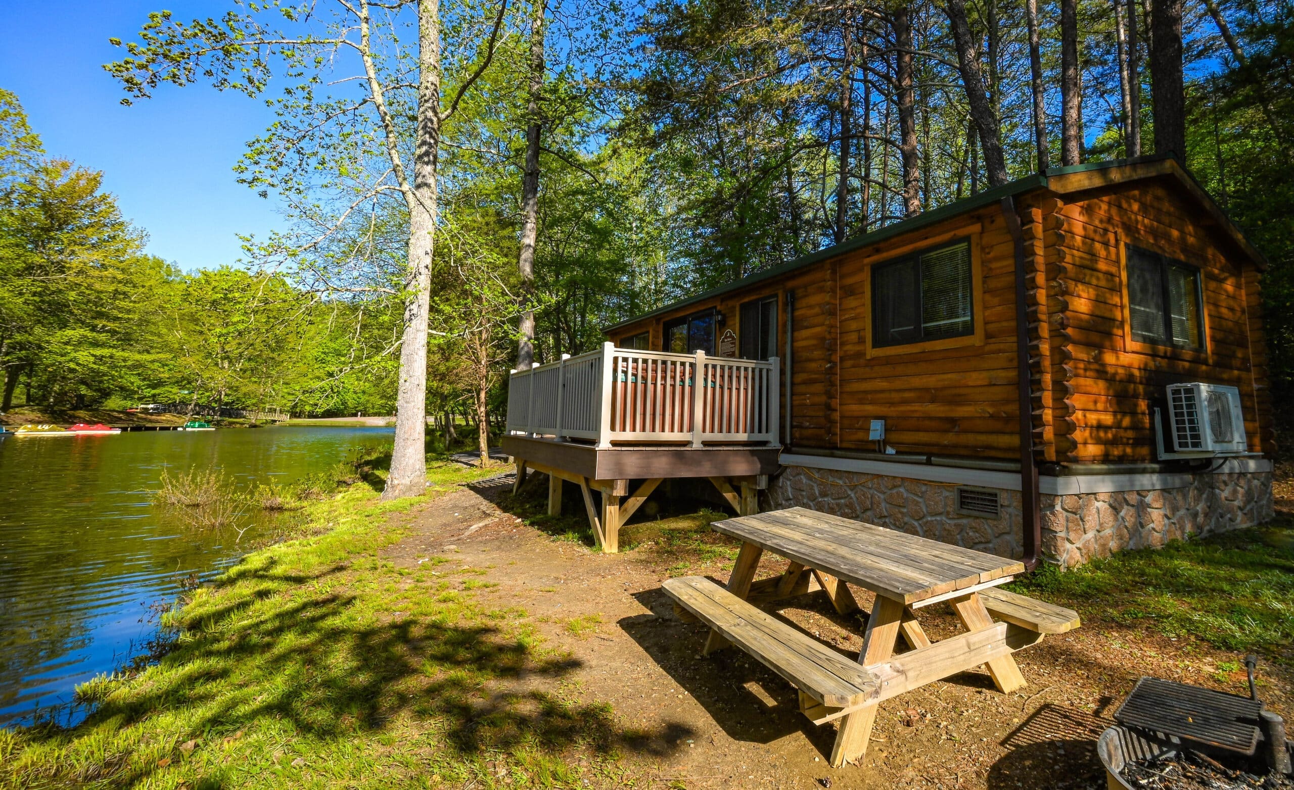 Cozy camp cabin at Wilderness Presidential Resort surrounded by Virginia woodland