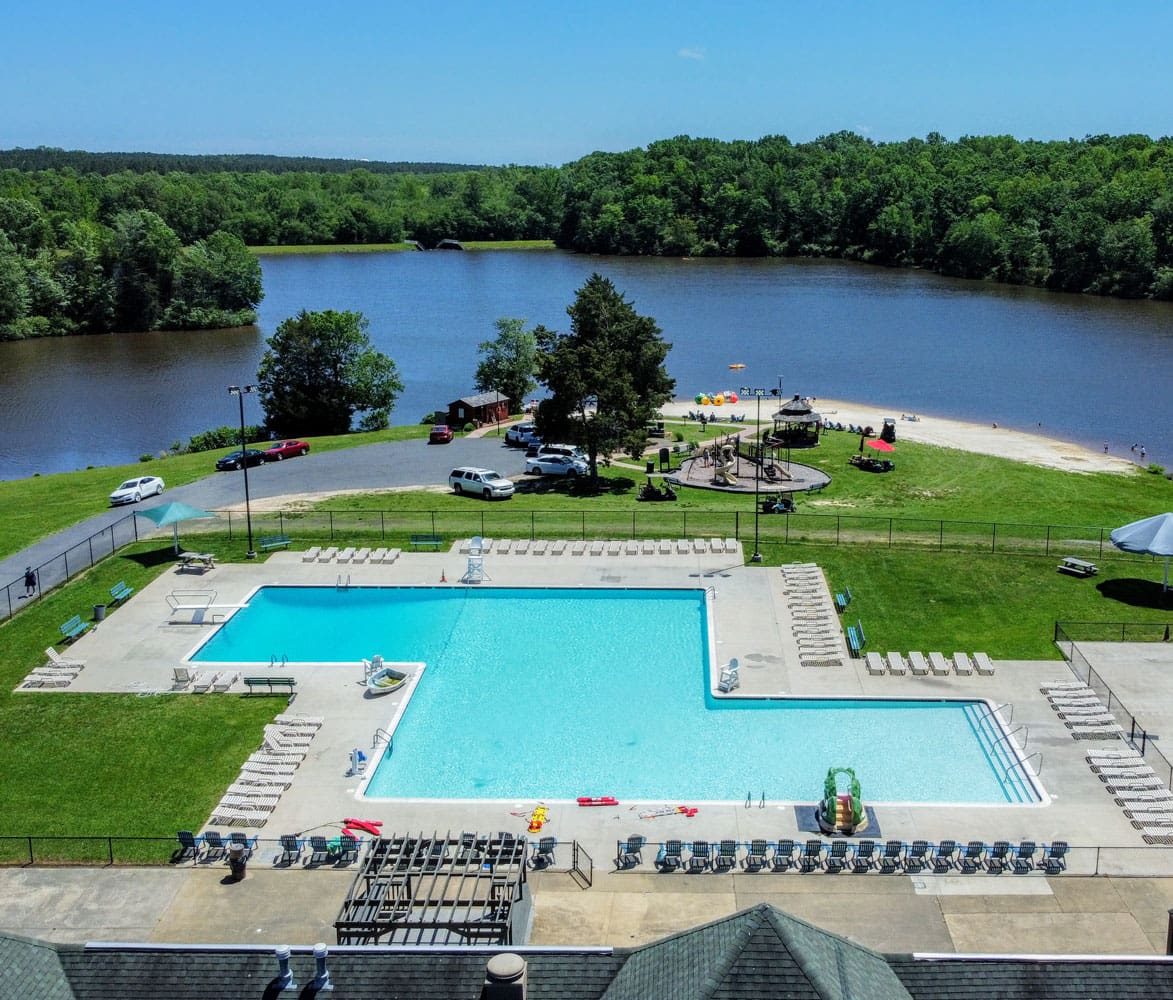 Aerial drone view of pool and lake at Wilderness Presidential Resort