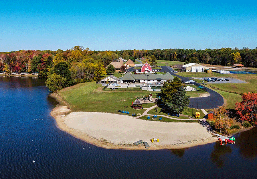 aerial photo of Wilderness resort beach & indoor pool on Hazel Grove Lake.